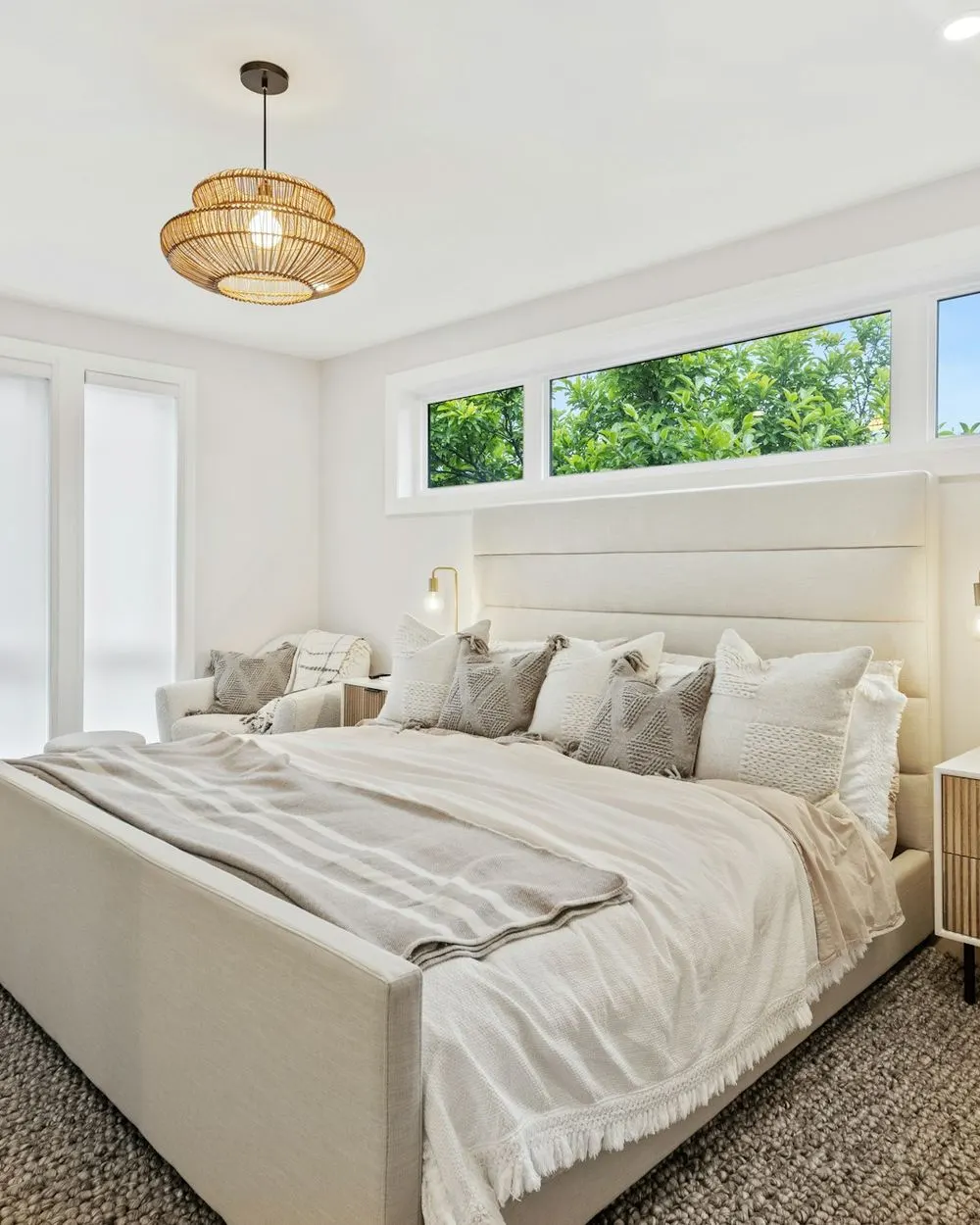Bright bedroom with a freshly made bed