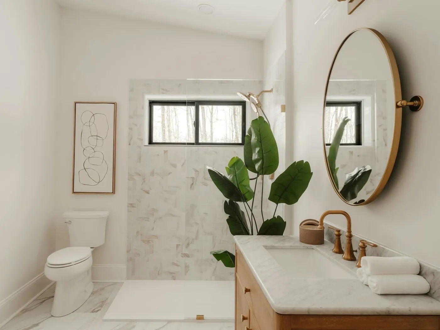 Bright bathroom with a round mirror after a deep cleaning